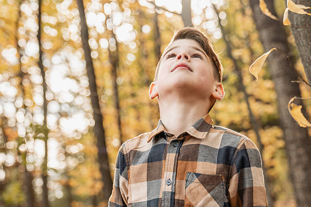 istock happy child playing outdoors in autumn park 2247778482