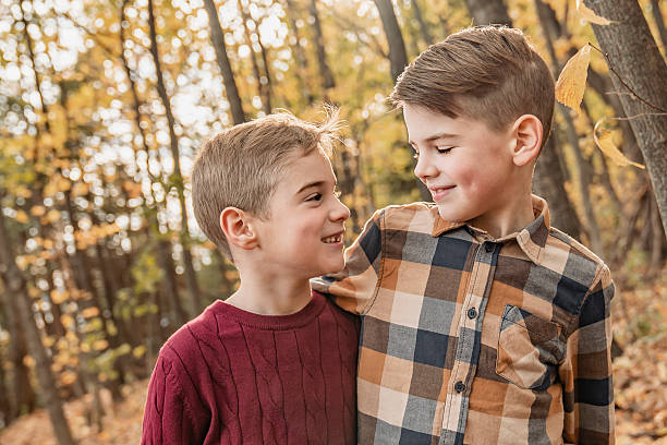 istock kids in autumn forest having great time together 2247778485