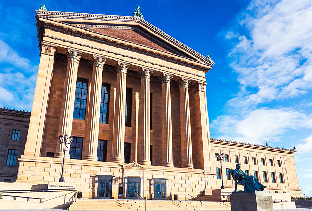 Philadelphia, USA - Tall columns along the West facade of the Philadelphia Art Museum, with a statue of Chief Justice John Marshall below the entrance steps.