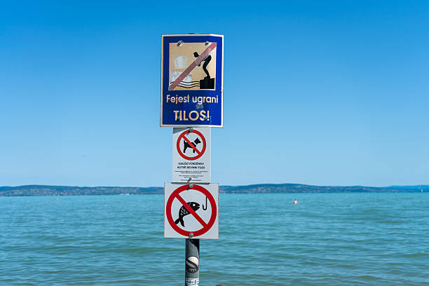 “No swimming” sign in the beach