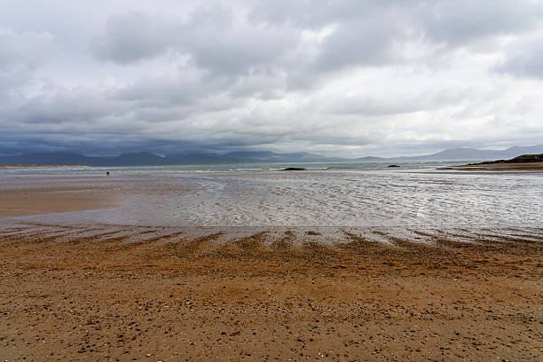 Low tide on Newborough Beach, Anglesey, on a cloudy overcast autumn morning.