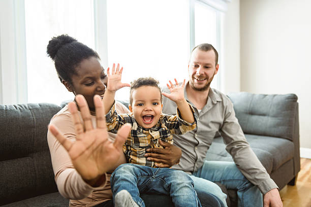 istock family with two years son having fun On sofa Together 2247781765