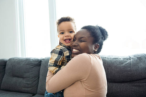 istock Mother and Son having fun on sofa Together 2247781784