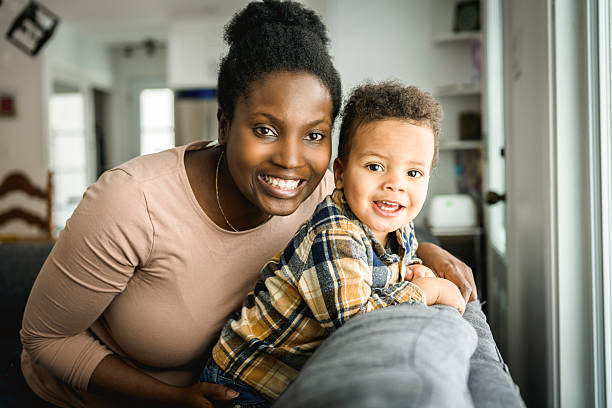 istock Mother and Son having fun on sofa Together 2247781800