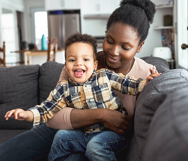 istock Mother and Son having fun on sofa Together 2247781801