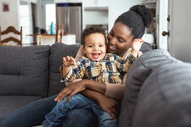 istock Mother and Son having fun on sofa Together 2247781806