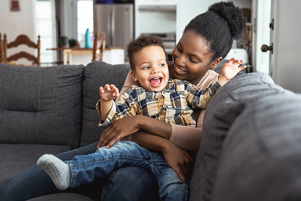 istock Mother and Son having fun on sofa Together 2247781807