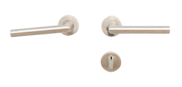 istock Two silver door grips or handles with separated keyhole isolated on white background with clipping path 2247782702