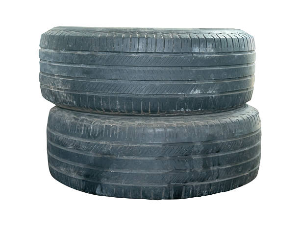 istock Two old black truck tires in stack isolated on white background with clipping path 2247782721
