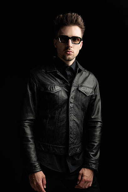 istock mysterious young man with sunglasses in black leather jacket 2247783214