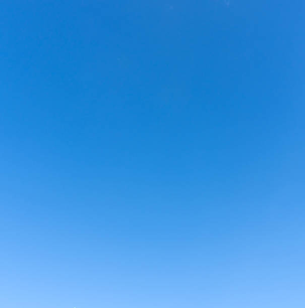 istock Low angle view and full frame of beautiful light blue sky without clouds in the afternoon on sunny day used as natural background texture in decorative art work 2247783328