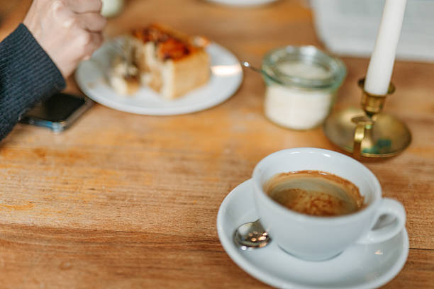 istock Espresso and pastry on wooden table in cozy cafe 2247783420