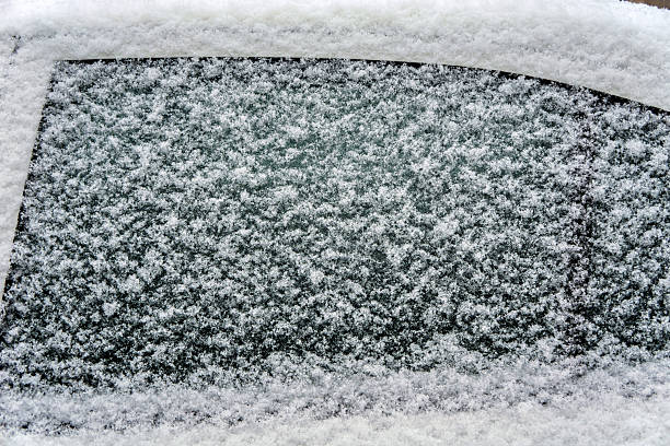 istock A car window covered in snow on a sunny day 2247784313