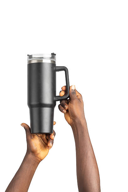 Two Black Hands Holding Insulated Tumbler Upward