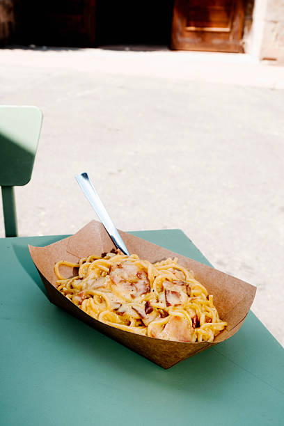 istock spaghetti alla carbonara in a brown paper bowl 2247785307