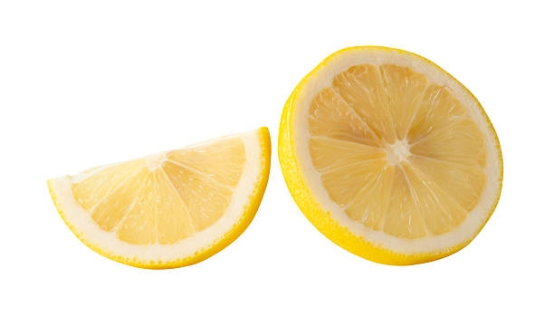 Front view set of ripe yellow lemon fruit in slices in circle and quarter shape isolated on white background with clipping path