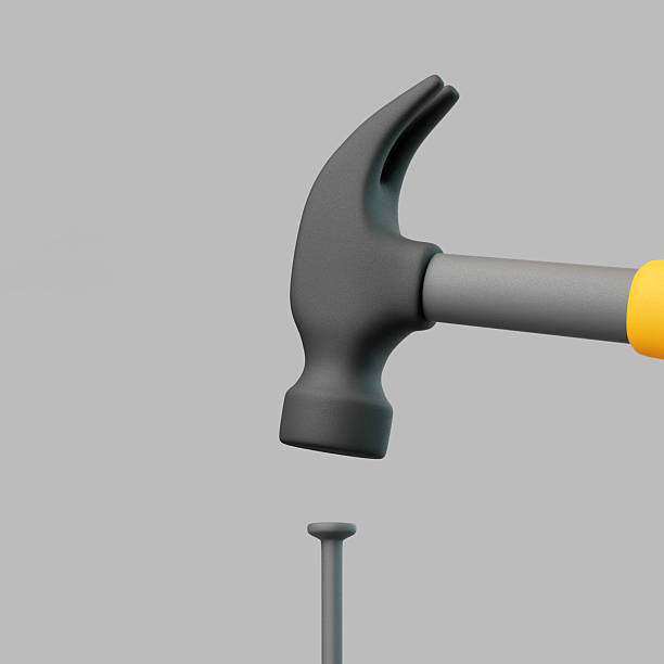 istock Hammer and Nail Isolated on Gray Background 2247789397