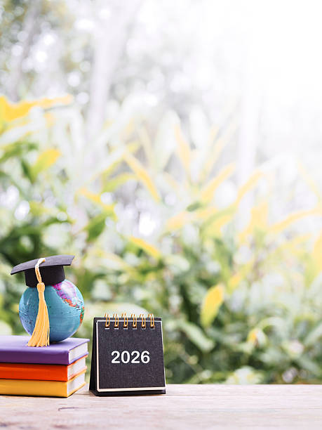 istock Student creative desktop, Earth globe with graduation hat on hardcover book and 2026 desk calendar. Copy space for text, Back to school, Education concept 2247790079