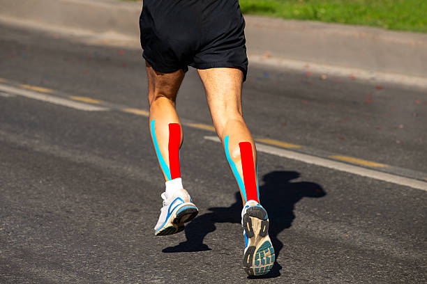 istock Kinesiotaping on runner calf muscle to running marathon race 2247791574