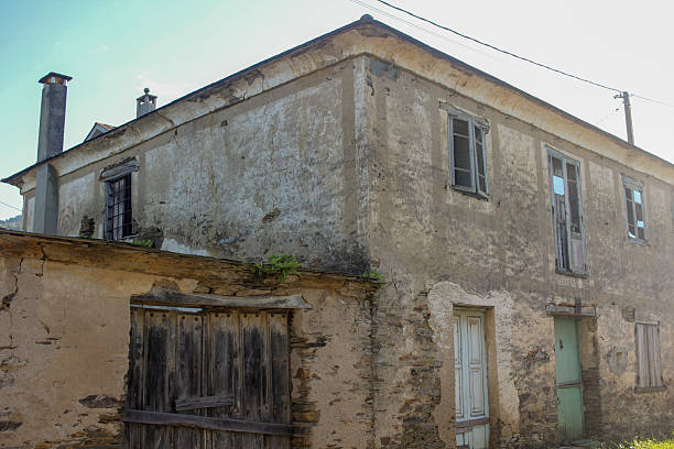 istock Old house in ruins under cloudy sky 2247791649