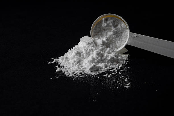 istock Creatine Powder With Measuring Scoop 2247794697