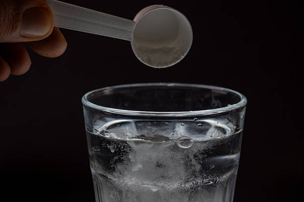 istock Creatine Powder Scooping Into Water Glass 2247794718