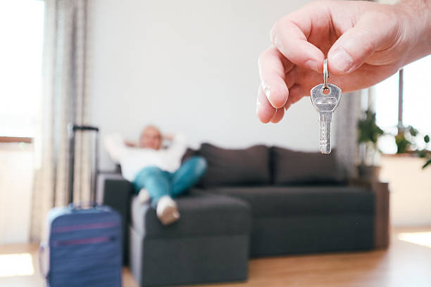 istock Couple with Keys and Suitcase in New Apartment 2247796248