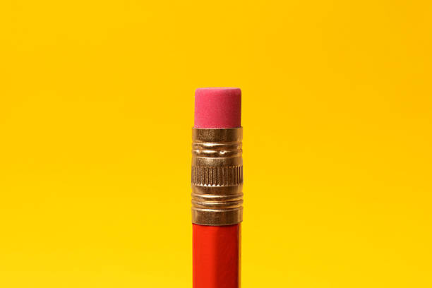 istock One graphite pencil on yellow background, closeup 2247797615