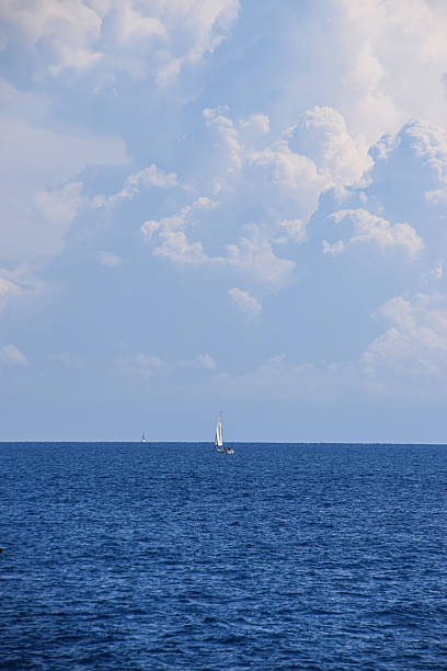 istock Sailboat and dramatic clouds on the horizon over the sea 2247797985