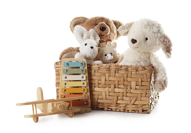 istock Different toys in wicker basket isolated on white 2247798220