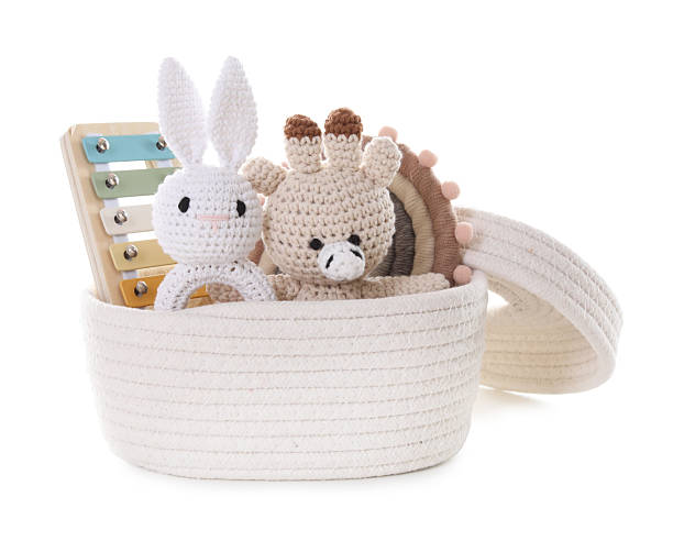 istock Different toys in wicker basket isolated on white 2247798244