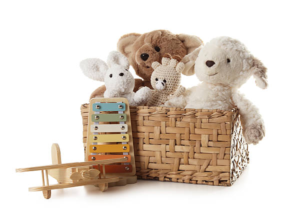 istock Different toys in wicker basket isolated on white 2247798260
