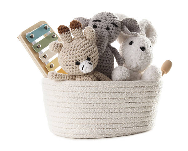 istock Different toys in wicker basket isolated on white 2247798265