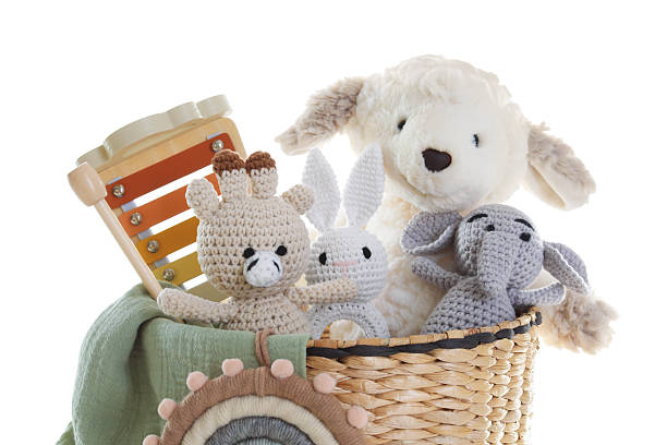 istock Different toys in wicker basket isolated on white 2247798278