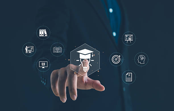 istock Businessman touching virtual icon of education, innovation, and learning with graduation cap and light bulb, symbolizing knowledge development, e-learning, and modern digital education concept. 2247798474