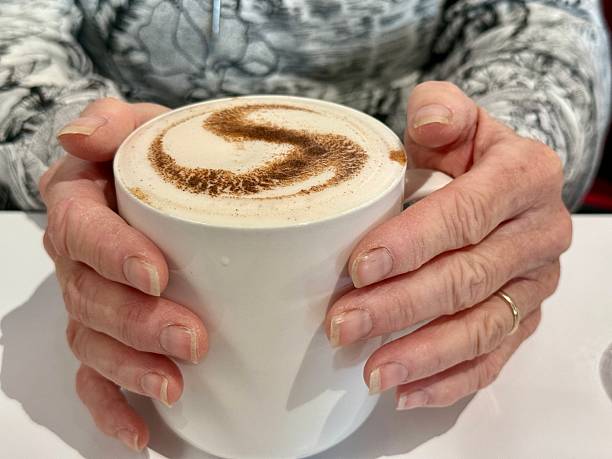 Woman's Hands Holding Latte