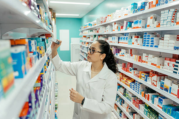 istock Pharmacist checking medicines on the pharmacy shelf. 2247798891