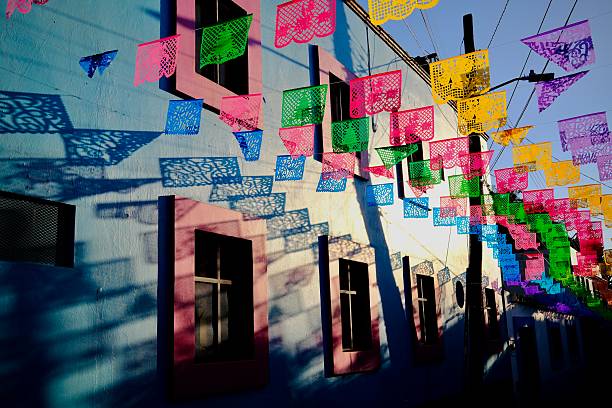 istock Papel Picado Shadows on Blue Wall in Jalatlaco (Oaxaca de Juarez, Mexico) 2247800896