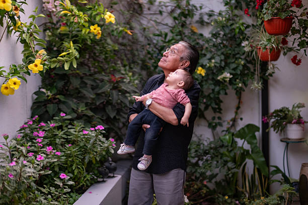 A grandchild playing with his grandfather
