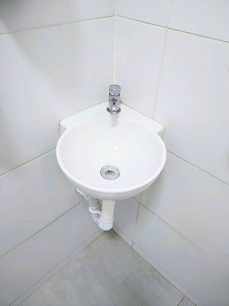 istock Sink for accessible bathroom. Public bathroom. Bathroom for people with disabilities. Corner sink. 2247803569