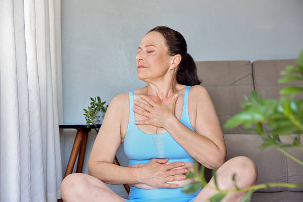 istock mature woman meditating 2247812016