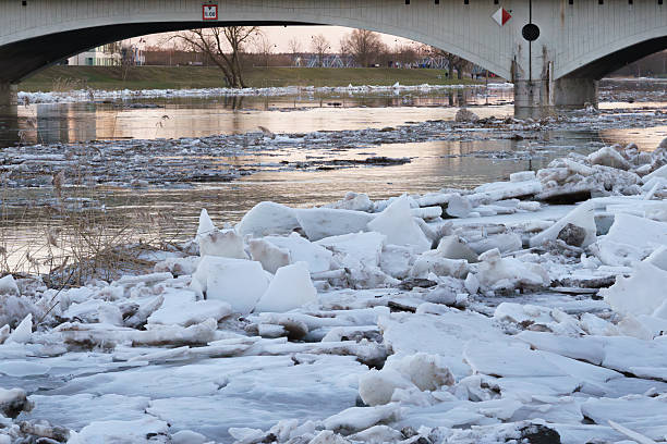 istock Ice Floes Piled Under Concrete Bridge Arch During Spring Thaw 2247814987