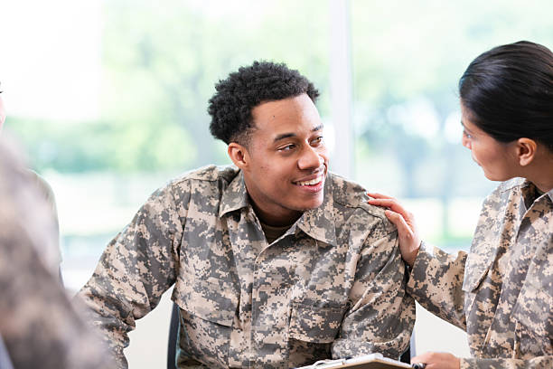 istock Military personnel receiving emotional support during a group discussion session. 2247815366