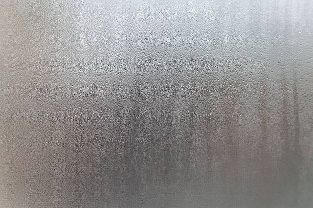 istock The imagetextured surface possibly a window or a wall with a pattern of droplets or condensation 2247822400