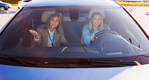 istock Driving Lesson with Instructor Giving Guidance from Passenger Seat 2247823007
