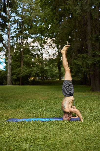 istock Balanced Yoga Pose Practiced in a Natural Environment Surrounded by Lush Greenery and Serenity 2247823034