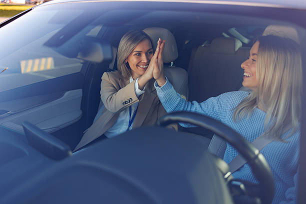 istock Celebrating Driving Test Success  Student Driver and Instructor Exchange High-Five 2247823193