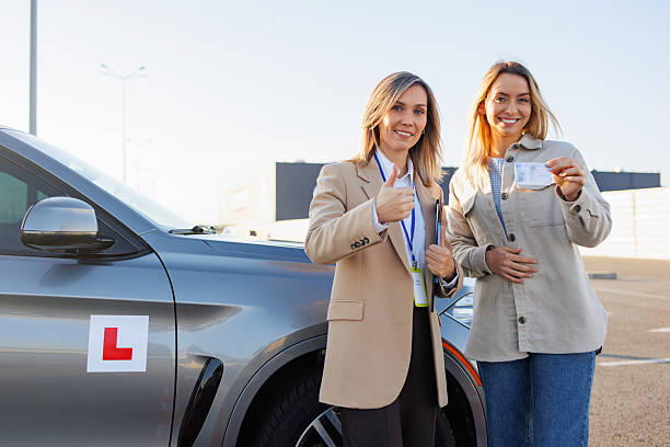 Happy Driving Student Holding New License After Successful Road Test