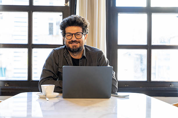 istock Confident businessman working remotely from cozy cafe 2247827791