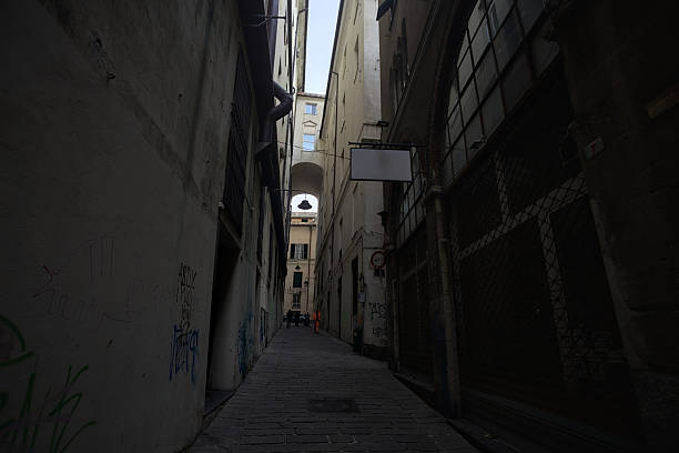 Genova, Italy - 12TH NOVEMBER 2025 - Side and overhead passage of the bishop's palace in Genova, in an alley in the shade